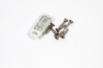 magnet and Many screw on white background - Physics Concept