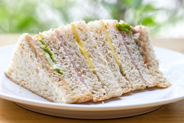 Sandwich with ham, tuna and vegetables ,Fresh sandwich and organic vegetable on wooden table ,Healthy food 