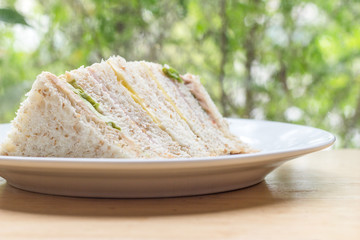 Sandwich with ham, tuna and vegetables ,Fresh sandwich and organic vegetable on wooden table ,Healthy food 
