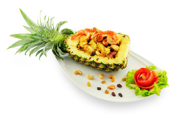 Thai rice with seafood in pineapple in white plate isolated