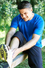 Man With Sports Injury Sustained Whilst Exercising Outdoors