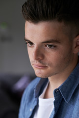 Naklejka premium Head And Sholuders Portrait Of Serious Teenage Boy