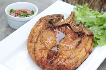 Fried snapper with fish sauce and spicy salad.