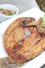 Fried snapper with fish sauce and spicy salad.