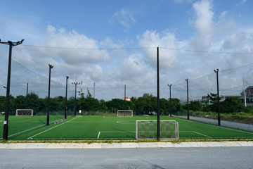 Futsal court in a public outdoor park with artificial turf