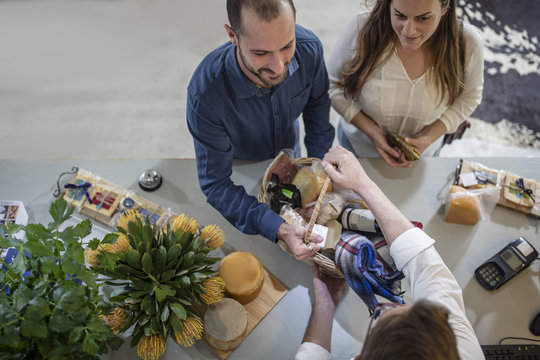 Couple going to pay purchase in a farm shop