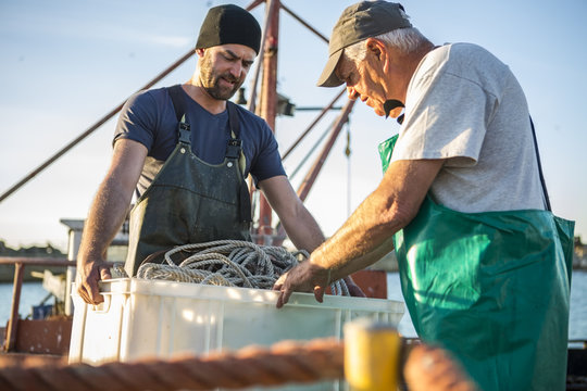 Fishermen working on trawler