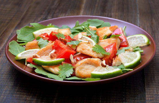 Chicken salad with tomatoes, arugula