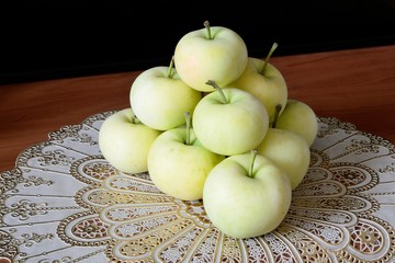 Pyramid of apples on the napkin