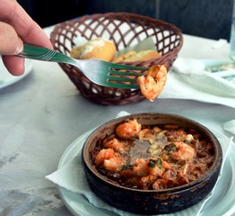Sizzling prawns with garlic. Traditional Spanish tapas dish.