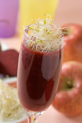 Fresh beet juice with leaves in a glass