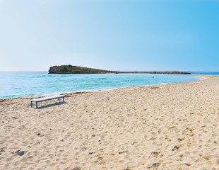 Fototapeta na wymiar Lonely sea coast. Island surrounding deep blie water