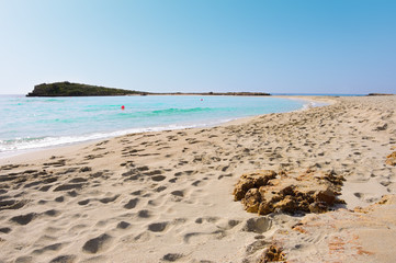 Lonely sea coast. Island surrounding deep blie water