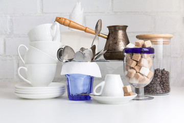 Coffee drink concept. Coffee cups, jezve, coffee beans, sugar cubes