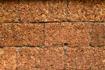 laterite stone blocks wall close-up for background