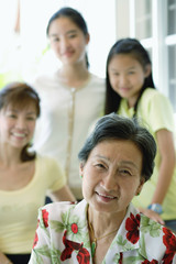Three generation family of females, selective focus