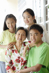 Grandmother sitting with her grandchildren