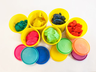 colorful play dough in yellow can