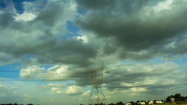 Moving Clouds Over Power Line
