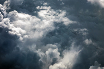 Fototapeta na wymiar Stormy cloudscape seen from the plane