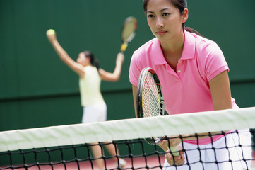 Women with tennis rackets, playing tennis