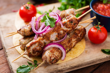 Minced Lula kebab grilled turkey (chicken) with vegetables.