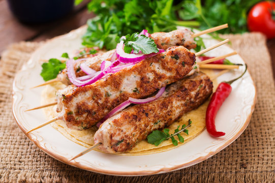 Minced Lula kebab grilled turkey (chicken) with vegetables.