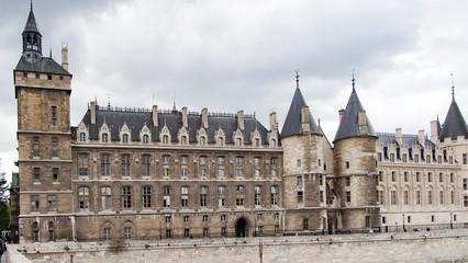 Fototapeta na wymiar Castle Conciergerie - former royal palace and prison. Conciergerie located on the west of the Cite Island View from the other side of the river Seine 