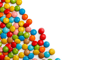 colorful chocolate buttons on white background