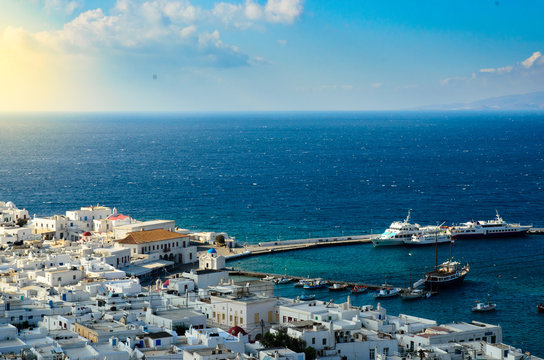 Top view of Mykonos island with Aegeon sea and blue sky