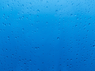 Water drops over blue