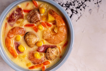 Homemade clam chowder with shrimps.