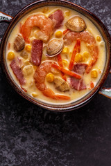 Homemade clam chowder with shrimps.