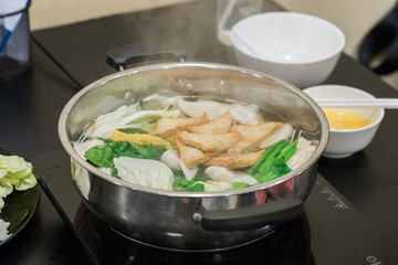 Restaurant menu in sukiyaki pot. Shabu.
