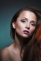 Naklejka premium nice beautiful girl with blue eyes and lovely makeup on face