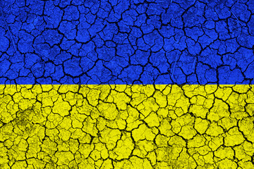 Flag of Ukraine painted on cracked wall. Political concept. Old texture. Vintage design. Famine and...