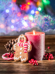 Gift boxes, candle lights and frozen window. Christmas backgroun