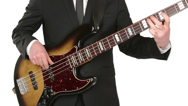 musician playing electric bass guitar isolated on white background