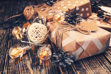 Christmas gifts wrapped in paper box, wrapped with twine.Christmas ornaments and decor.