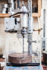 drilling machine in jeweler's workroom