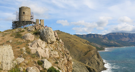 ruins of ancient tower on top of a mountain