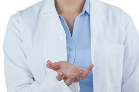 Mid-section of female doctor gesturing