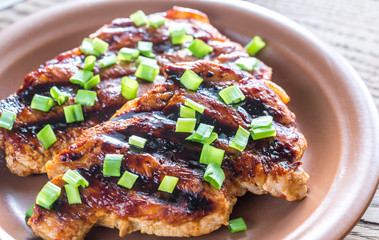 Grilled pork steaks on the plate