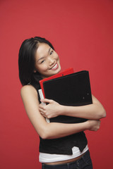 Woman carrying books, portrait