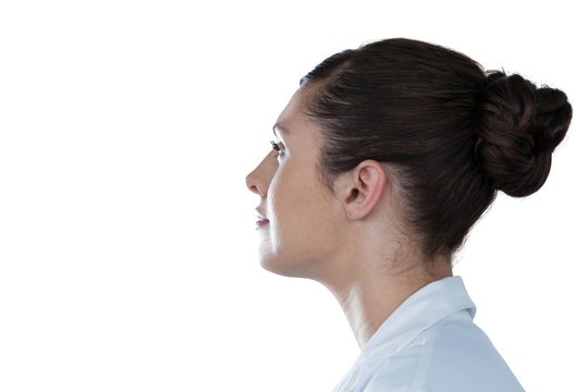 Side view of thoughtful female scientist looking away