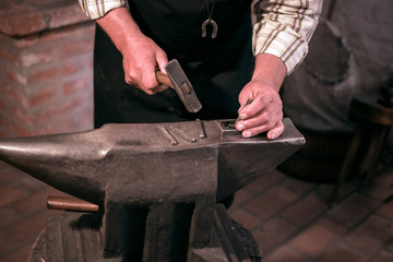 Blacksmith creates lucky horseshoe