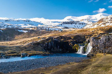 Fototapeta na wymiar Kirkjufell Mountain and Krikjufellfoss Waterfall, Iceland