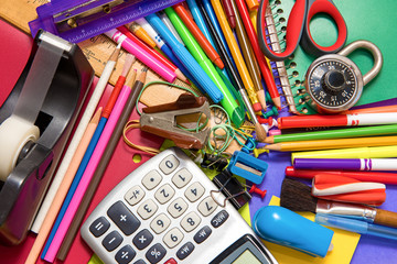 Full background of a colorful assortment of school supplies