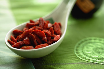 Close-up of dried fruit in ceramic spoon