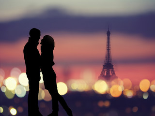 silhouette of romantic lovers with eiffel tower on a background in Paris , France